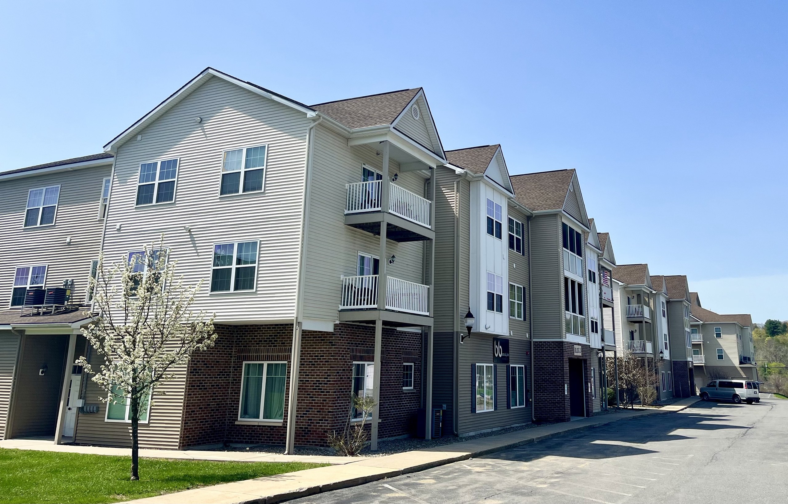 Ridgeview Townhomes, Gansevoort, NY: Apartment building with spring blossoms