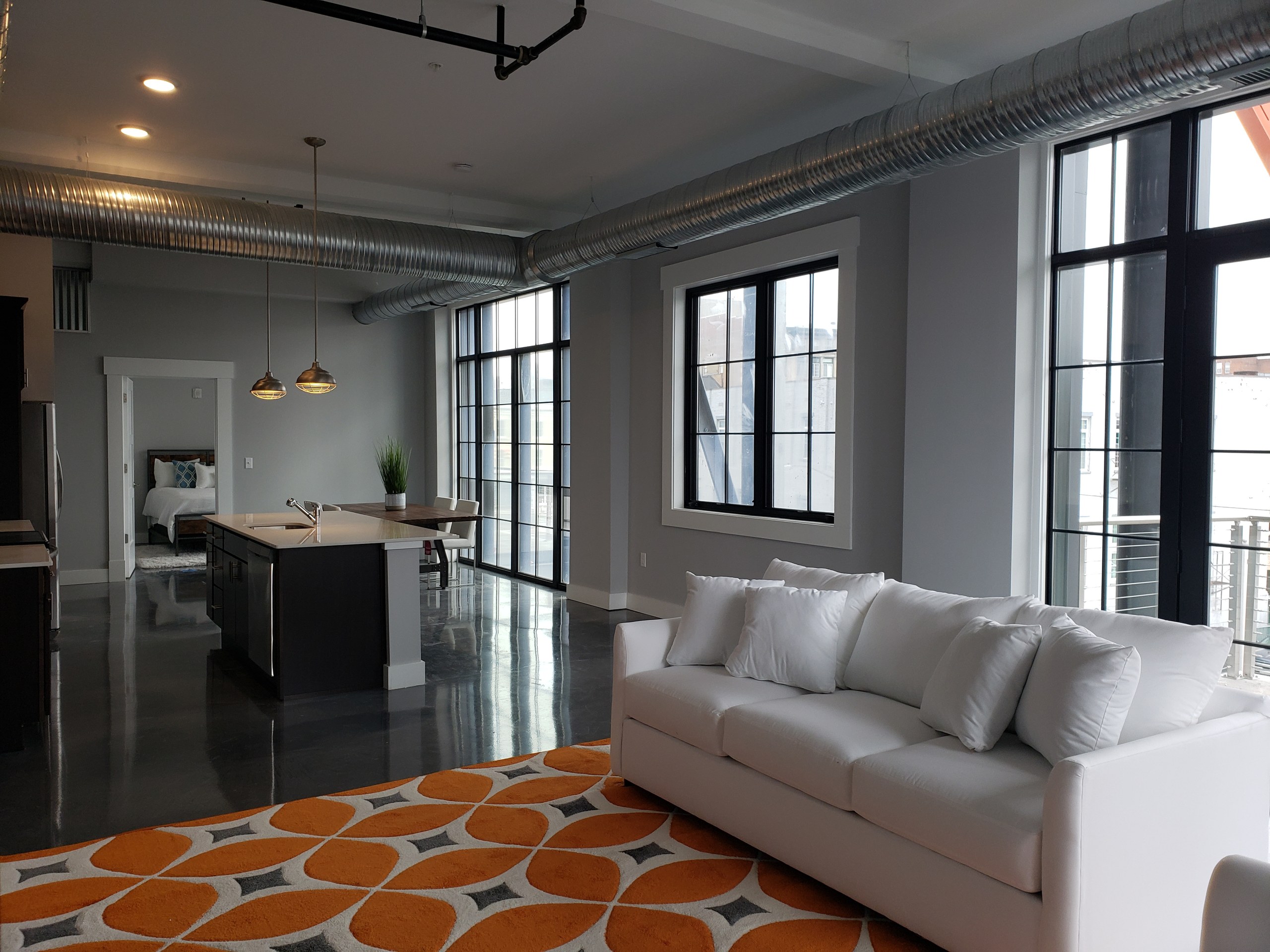 The Lofts at Frog Alley, Schenectady, NY: Loft living room and windows